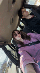 Young couple films themselves in car during Krasnoyarsk traffic