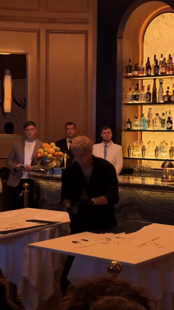 Performance artist 'Mr Drip' paints at London restaurant opening