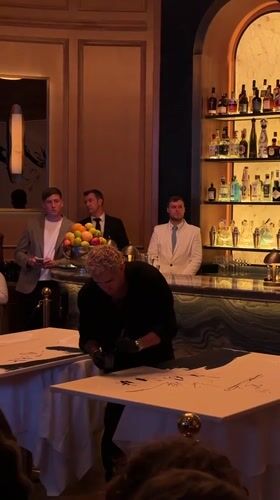 Performance artist 'Mr Drip' paints at London restaurant opening