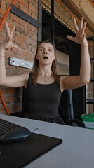 Woman meditates at desk in Chaikovsky, Russia morning session