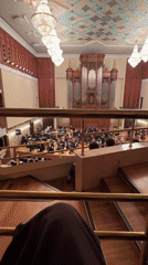 Orchestra concert performance documented in ornate Kazan concert hall