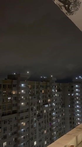 Nighttime apartment building views documented across Krasnodar residential district
