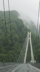 Vehicle crosses cable-stayed bridge in Kepsha, Russia