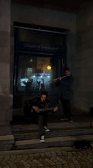 Street musicians perform near Moscow Cinema in Yerevan