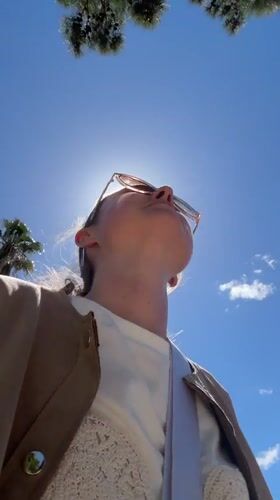 Woman enjoys sunny morning amid Mediterranean scenery in Kumbor