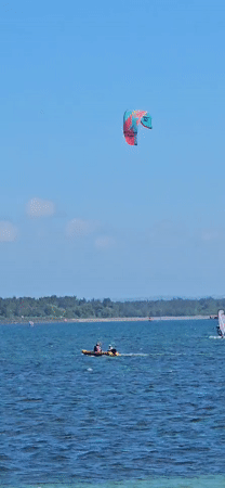Sunny morning beach activities observed in Denpasar, Indonesia