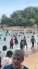 Busy beach day captured at Rumassala, Sri Lanka