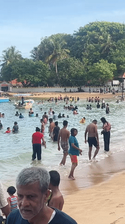 Busy beach day captured at Rumassala, Sri Lanka