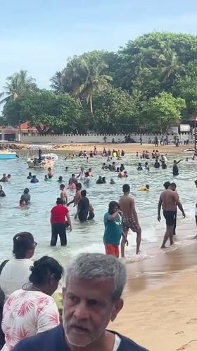 Busy beach day captured at Rumassala, Sri Lanka