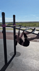 Morning calisthenics workout on park fitness equipment in Khabarovsk