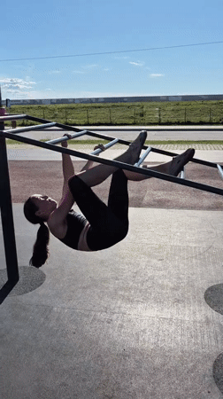 Morning calisthenics workout on park fitness equipment in Khabarovsk