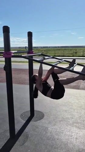 Morning calisthenics workout on park fitness equipment in Khabarovsk