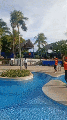 Resort staff perform synchronized poolside entertainment in Venezuela