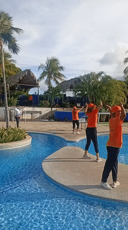 Resort staff perform synchronized poolside entertainment in Venezuela