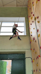 Boy climbs indoor rock wall in Izhevsk
