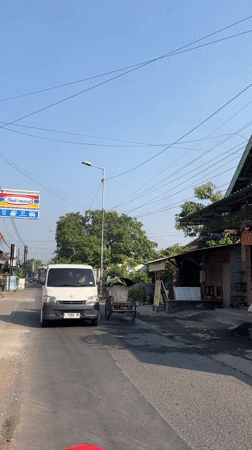 Early morning street life across a Kedungsolo village