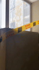 Caution tape blocks a wall opening in Caracas