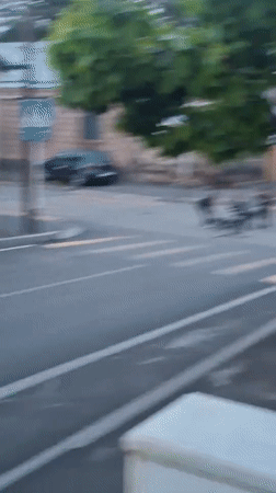 Young people gather with bicycles at Gyumri crosswalk