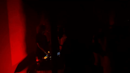 Early morning DJ set captured in red-lit Mexico City room
