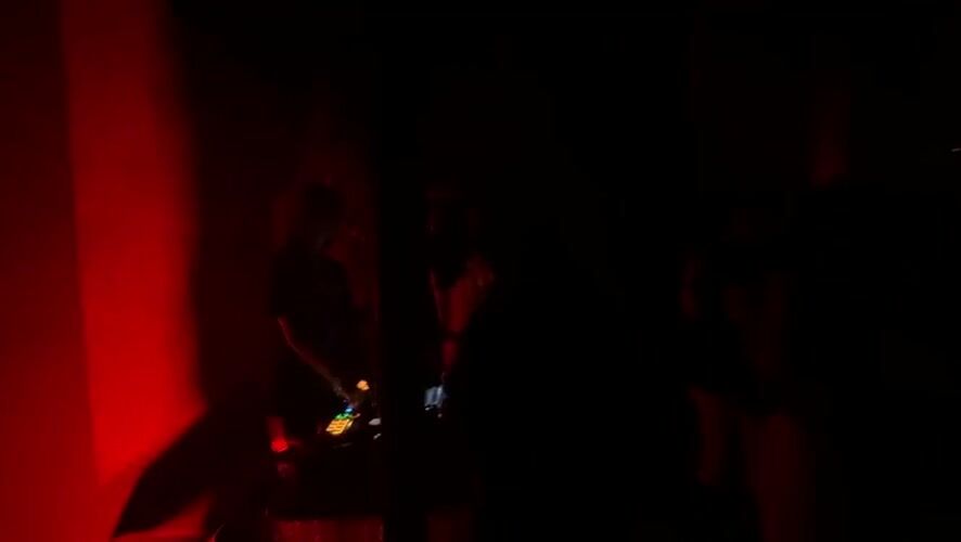 Early morning DJ set captured in red-lit Mexico City room
