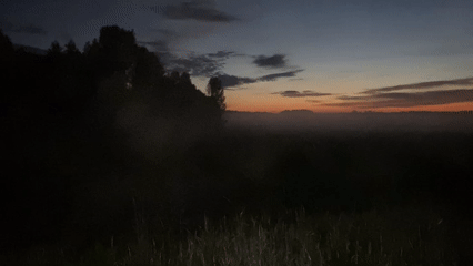 Dusk settles over a foggy rural road near Nizhny Novgorod