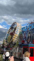 Fairground with spinning rides, Simpsons funhouse operates in South Norfolk