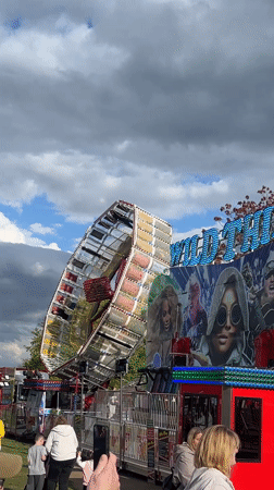Fairground with spinning rides, Simpsons funhouse operates in South Norfolk