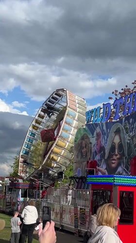 Fairground with spinning rides, Simpsons funhouse operates in South Norfolk