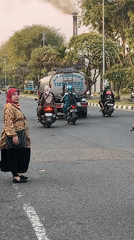 Rush hour traffic moves through the streets of Candi, Indonesia