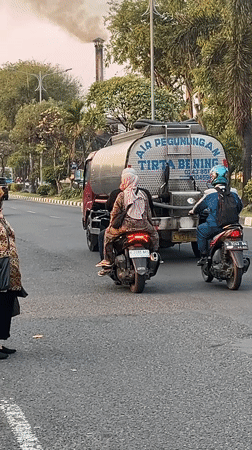 Rush hour traffic moves through the streets of Candi, Indonesia