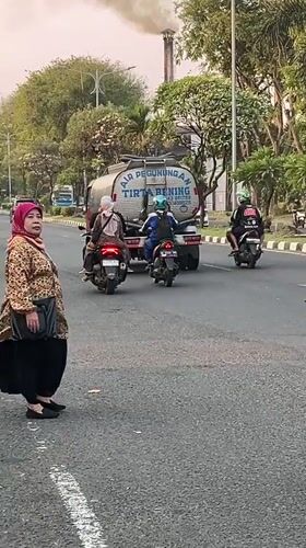 Rush hour traffic moves through the streets of Candi, Indonesia