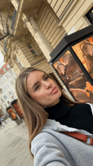 Woman Takes Selfie Videos on Berlin Sidewalk