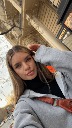 Woman Takes Selfie Videos on Berlin Sidewalk