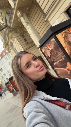 Woman Takes Selfie Videos on Berlin Sidewalk