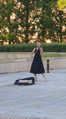 Street performers and summer crowds fill Warsaw's historic center