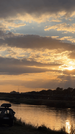 Sunset, beach, and live music setup on Wrocław's Oder riverbank