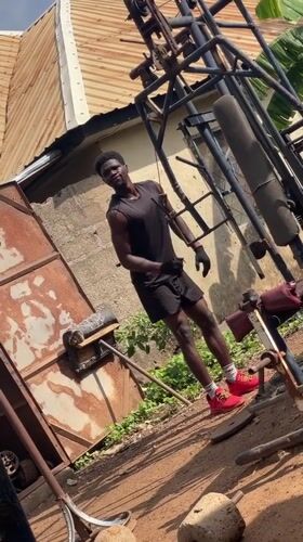 Men exercise at homemade outdoor gym in Akwanga Nigeria