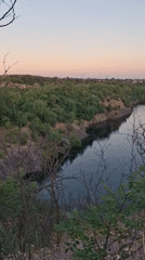 Quarry lake and railway viaduct at dusk, Kryvyi Rih