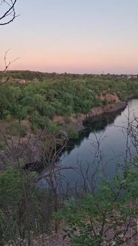Quarry lake and railway viaduct at dusk, Kryvyi Rih