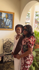 Women photographed near saxophone artwork in Bar Jirgi Summa