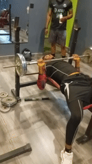 Bench press rep at the top of the lift