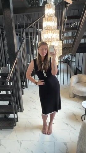Woman takes selfies in luxury Moscow area interior