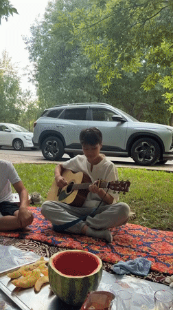 Informal music session in Astana park features traditional instruments