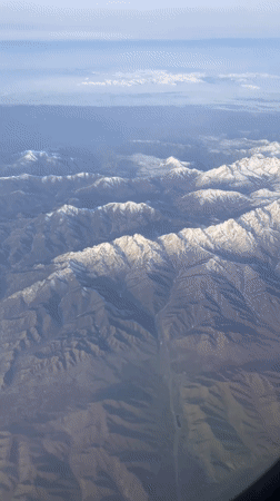 Passenger captures aerial mountain views during Kazakhstan flight