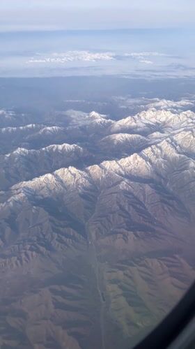 Passenger captures aerial mountain views during Kazakhstan flight