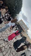 Traditional circle dance performed in Bulgarian village square