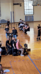 Fashion show takes over a Milan gymnasium basketball court