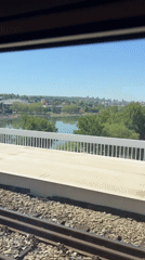 Train passenger records sunny landscape view from Belgrade railway
