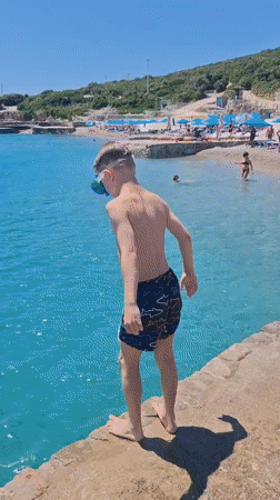 Summer beach day unfolds in Prijevor, Montenegro coastal waters