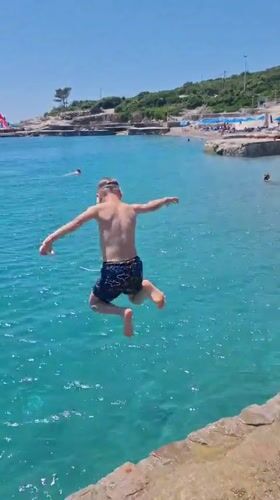 Summer beach day unfolds in Prijevor, Montenegro coastal waters